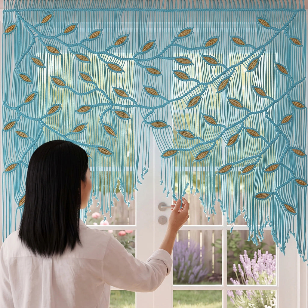 A woman viewed from behind stands in front of a large window, touching a sheer curtain panel with an embroidered leafy vine pattern in warm beige and brown tones. The background outside the window is softly blurred with pink and green foliage.