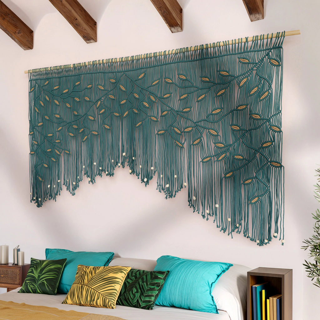 Decorative wall hanging with green and gold pattern above a bed with colorful pillows.