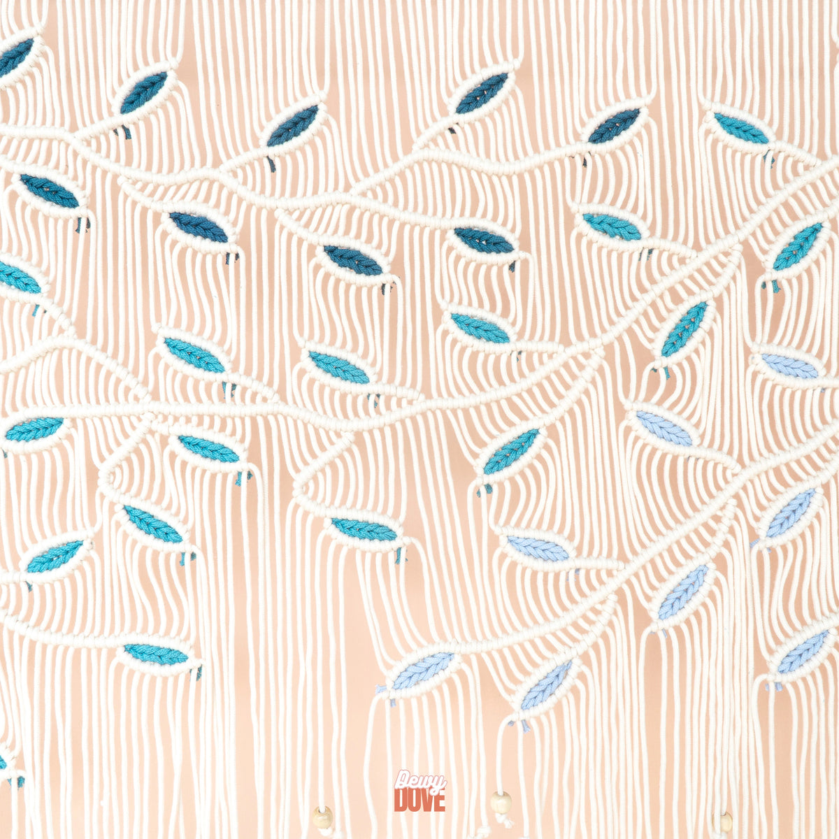 A close-up of a patterned fabric or wallpaper featuring a peach background with white wavy lines and stylized blue and teal leaf-like motifs.