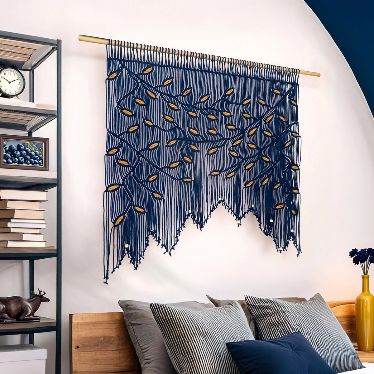 Premium handmade navy macrame wall decor showcasing meticulous artisan knotting and a graceful, arched fringe silhouette.