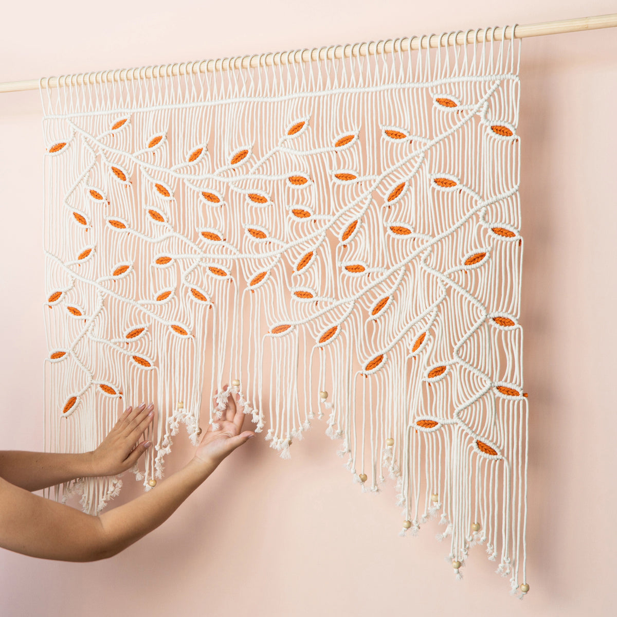 Modern boho natural macrame tapestry designed with warm earth tones, ideal for bedroom headboards and living room focal walls.