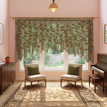 Handcrafted olive green macrame wall hanging featuring an intricate botanical canopy of dark green vines and vibrant orange leaves, hung above a modern green velvet sofa.