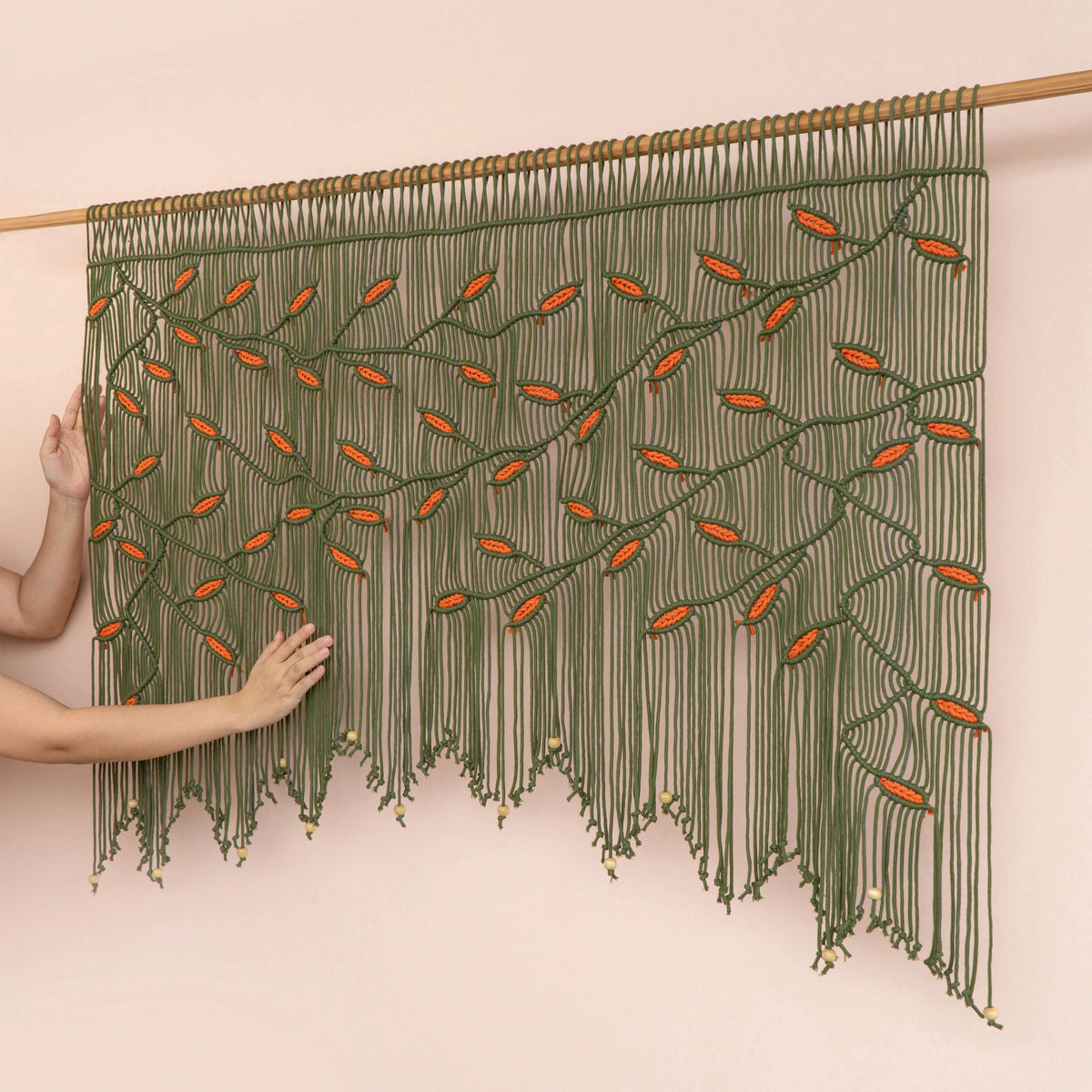 Modern boho olive green macrame tapestry designed with warm earth tones, ideal for living room focal walls and bedroom headboards.