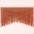 A brown fringed wall hanging or curtain with an embroidered leafy vine pattern, displayed against a plain light background.